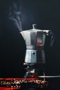 Moka pot old coffee maker and coffee beans Royalty Free Stock Photo