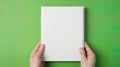 Mokap hands with an empty notebook suitable for presenting an application or website design