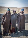 Mokhotlong, Lesotho - September 11, 2016: Three unidentified young African sheperds in traditional thick blankets