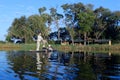 A mokor poler takes guests to a resort on the Okavango Delta in Botswana Royalty Free Stock Photo