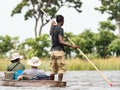 Local man working on Mokoro to deliver tourists and campers across the rivers of the Delta Okawango, Botswana Royalty Free Stock Photo