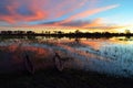 Mokoro in the Okavango delta at sunset, Botswana Royalty Free Stock Photo