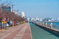 MOKPO, KOREA, NOVEMBER 6, 2019: People are strolling at seaside promenade in Mokpo with a dancing fountain, Republic of Korea