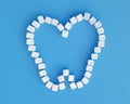 Molar from sugar cubes on blue background, concept for sweet tooth, caries. Sugar is the cause of tooth decay Royalty Free Stock Photo