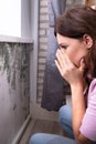 Mold Damage On House Wall. Woman Looking