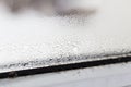 Mold on a foggy plastic window of white color. Royalty Free Stock Photo