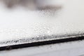 Mold on a foggy plastic window of white color. Royalty Free Stock Photo