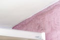 Mold and moisture buildup on pink wall