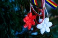 Moldavian and Romanian spring symbol. Martisor on green natural background with tricolor elements. Martisor is a red and white Royalty Free Stock Photo