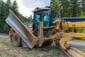 The moldboard of a Caterpillar 14M Motor Grader parked near Pass Lake in British Columbia, Canada - April 30, 2019 Royalty Free Stock Photo