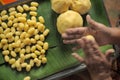 Molding yellow mashed bean with hand (Thai traditional dessert). Med Khanoon is one of the nine auspicious Thai desserts