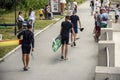 Moldova, Rybnitsa - July 2021: Athletes carry kayaks after competition on river. Spectators and fans of kayak race