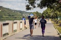 Moldova, Rybnitsa - July 2021: Athletes carry kayaks after competition on river. Spectators and fans of kayak race