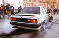 Moldova 25.09.2019. Sport modern Stance Car racing car drifting with smoke drift burnout, big colourful green blue clouds with Royalty Free Stock Photo