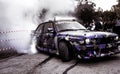 Moldova 25.09.2019. Sport modern Stance E30 BMW Car racing car drifting with smoke drift burnout, big clouds with Royalty Free Stock Photo