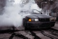 Moldova 25.09.2019. Sport modern Stance E36 BMW Car racing car drifting with smoke drift burnout, Huge clouds with Royalty Free Stock Photo
