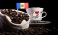 Moldovan flag in a bag with coffee beans isolated on black
