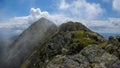 Moldoveanu Peak, Carpathian mountains, Fagaras, Romania. Mountain ridge in clouds.