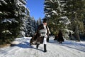 Moldovita, Romania, November 30th, 2018: Children wearing traditional playing with the sleigh in Bucovina