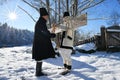 Moldovita, Romania, November 30, 2018: Young boy is being sounded the wood in traditional way in Bucovina