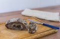 Moldy bread on a cutting board. Close-up view. Selective focus.