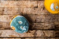 Moldy lemon fruit on a wooden table