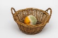 Moldy orange in a wicker basket on a light background, texture of green mold, selective focus. Not fresh and rotten fruits. Royalty Free Stock Photo