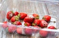 Moldy strawberries in the box. Rotten berries in summer. Bad conditions of preservation