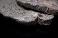 Moldy white bread on a black background. Royalty Free Stock Photo