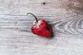 Moldy and wrinkled rotten peppers. Concept of unhealthy, decompose, spoiled vegetables. Garbage dump rotten food on wooden