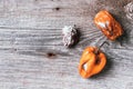 Moldy and wrinkled rotten peppers. Concept of unhealthy, decompose, spoiled vegetables. Garbage dump rotten food on wooden