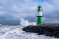 Mole on shore of the Baltic Sea during the storm Eunice in Warnemuende, Germany