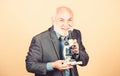 Molecular biology PhD projects. Mature man formal suit with microscope. Doctoral work and postdoctoral employment Royalty Free Stock Photo