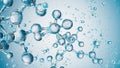 Molecular Harmony: Atoms in Water with a Serene Blue Background Royalty Free Stock Photo