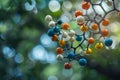 Molecular model hanging in front of a green background with bokeh Royalty Free Stock Photo