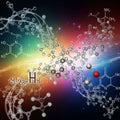 Molecular structures are depicted against a vibrant, multicolored Royalty Free Stock Photo