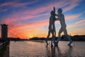 Molecule man over Spree river in Berlin at sunset with city silhouette and particular clouds Royalty Free Stock Photo