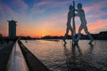 Molecule man over Spree river in Berlin at sunset with particular clouds Royalty Free Stock Photo