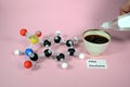 Molecule model of E954 Saccharin an artifical sweetener with associated usage sample. White is Hydrogen, black is Carbon, red is