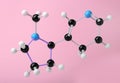 Molecule of nicotine on pink background. Chemical model