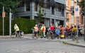 Molenbeek, Brussels Capital Region, Belgium - Cheering group of mainly woman cycling during the car free sunday