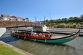 Moliceiro boat and bridge over the canal, Aveiro. Front moliceiro boat, a traditional boat used to collect seaweed