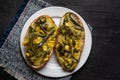 Molletes with poblano rajas and cheese on dark background. Mexican food Royalty Free Stock Photo