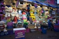 Molln, Germany, November 06, 2021: raffle ticket booth with oversized colorful plushies or stuffed toy animals and other prizes at