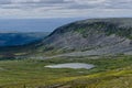 Molnet Nipfjallet mountain with gray steep rocky cliff in Sweden