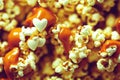 Molten caramel flows smoothly from airy flakes of caramel popcorn.