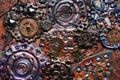 Molten colored gears and shiny elements. Flexible Steampunk background Royalty Free Stock Photo