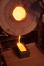 Molten gold being poured from furnace