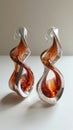 Molten metal style earrings, silver color and flowing shape.