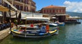 Molyvos Harbour with boats and restaurants.